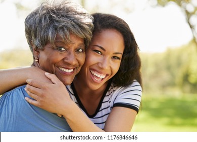 Portrait Of Senior Mother With Adult Daughter In Park