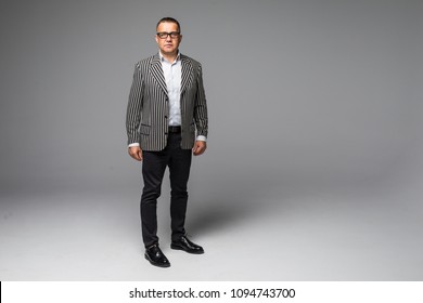 Portrait Of A Senior Older Business Man Standing Wearing Dark Sunglasses On White Background