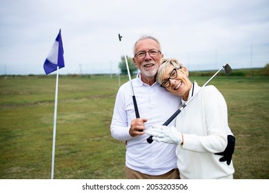 Portrait of senior people or golfers enjoying their retirement on golf course. - Powered by Shutterstock