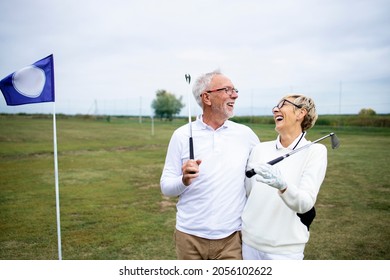 Portrait of senior people or golfers enjoying retirement by playing golf. - Powered by Shutterstock