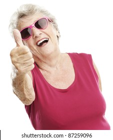 portrait of senior woman approve gesture against a white background