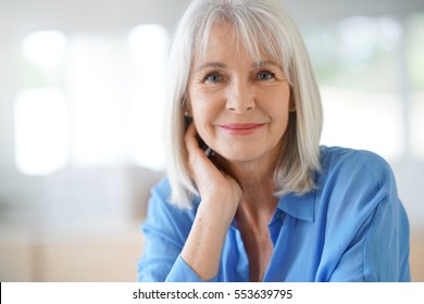 Portrait of senior woman with blue shirt