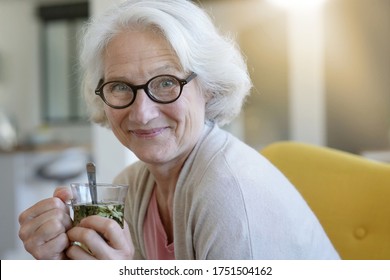 Portrait Of Senior Woman Drinking Herbal Tea