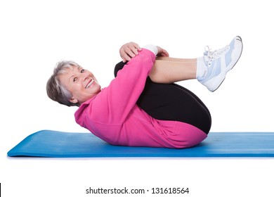 Portrait Of Senior Woman Exercising On White Background