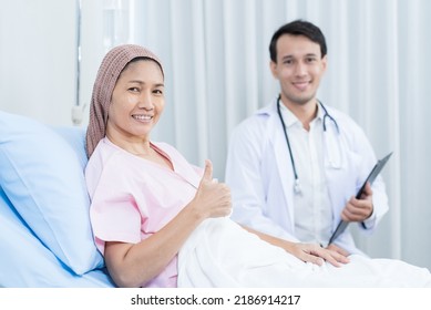 Portrait Of Senior Woman Patient Lying Down With Doctor In Hospital Ward. Physician Therapist Pharmacist Man Visit And Give Diagnosis Service Treatment Elderly Older Female And Smile, Look At Camera.