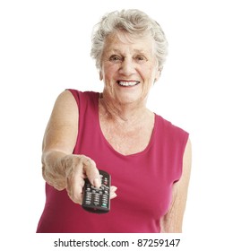 portrait of senior woman using remote control over white background