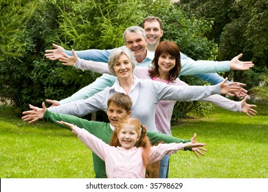 Portrait of senior and young couples with their children having fun outdoors - Powered by Shutterstock