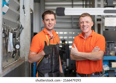 Portrait Of Senior And Young Mechanics Man Show Thumbs Up And Arms Cross Look At Camera At  Automobile Service, Technicians Service Check And Repair Car At  Auto Service Garage