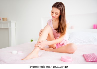 Portrait Of Sensual, Sexy, Pretty, Stylish, Attractive, Charming, Cheerful, Cute, Brunette Girl Using Body Cream On Her Dry Skin Of Legs, Enjoying Softness After Lotion, Wellness, Wellbeing Concept