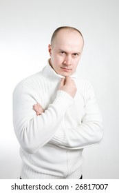 Portrait Of Serious 35 Years Old Man In White Sweater