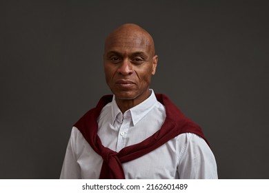Portrait of serious african american winemaker or sommelier looking at camera. Adult successful male entrepreneur. Viticulture and winemaking. Isolated on grey background. Studio shoot. Copy space