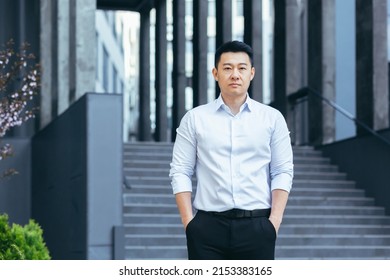 Portrait Of Serious Asian Businessman, Man Outside Office Looking At Camera