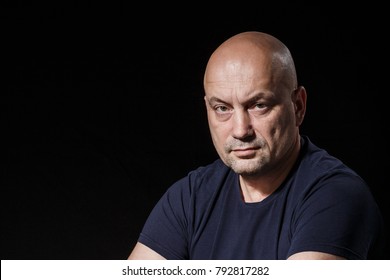 Portrait of serious bald man, looking at the camera. - Powered by Shutterstock