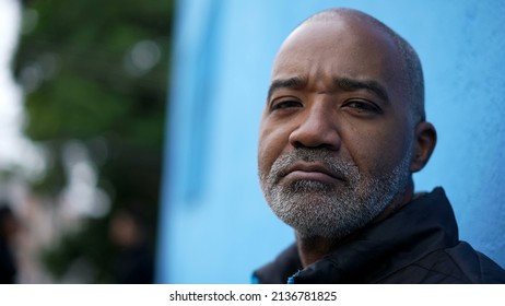 Portrait Of A Serious Black Senior Man Looking At Camera Face Closeup