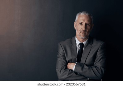 Portrait, serious and businessman with mockup, confident lawyer or attorney on dark studio background. Boss, ceo and professional business owner, proud senior director at law firm with arms crossed. - Shutterstock ID 2323567531
