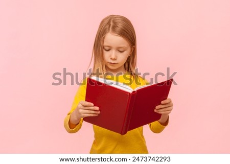 Similar – Image, Stock Photo Happy little girl reading and relaxing lying over sleeping mat in a cozy tent at home