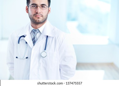 Portrait Of Serious Doctor With Stethoscope Looking At Camera