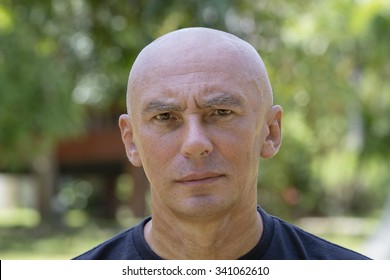 Portrait of serious elderly man in nature. Close up - Powered by Shutterstock