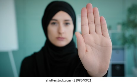 Portrait Serious Frustrated Angry Arabian Muslim Islamic Girl In Black Hijab Upset Woman Looking At Camera Holding Hand In Front Forbidden Gesture Refusal Stop Symbol Keep Distance No Gesture Refuse