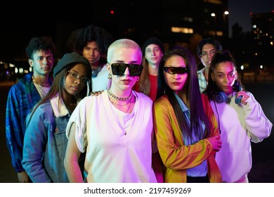 Portrait of serious gen Z people looking camera with serious face. Night club lifestyle - Shutterstock ID 2197459269