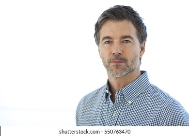 Portrait Of A Serious Handsome Man Isolated On White