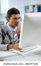 Portrait Of Serious Indian Coder Looking At The Screen