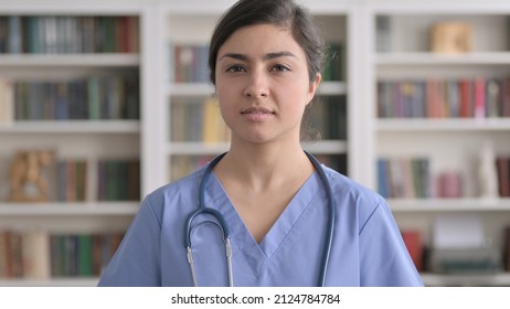 Portrait Of Serious Indian Female Doctor Looking At The Camera