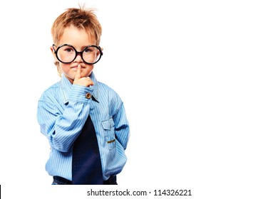 Portrait of a serious little boy in spectacles and suit. Isolated over white background.