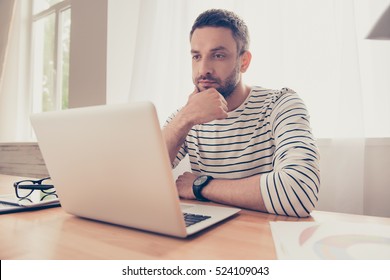 Portrait Of  Serious Man Looking  At Laptop