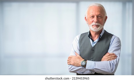 Portrait Of Serious Older Business Man Looking At Camera With Confidence With His Arms Crossed. Concept Of Confident Successful Older Business Man