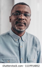 Portrait Of Serious Senior African American Man In Eyeglasses Looking At Camera