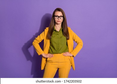 Portrait of serious smart confident elegant boss business lady put hands waist isolated over purple color background - Powered by Shutterstock