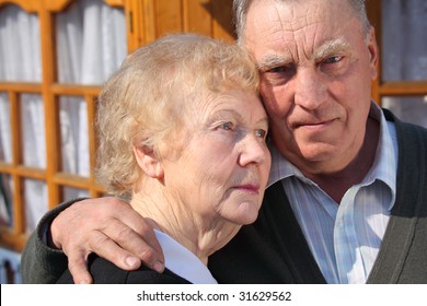 Portrait Of Serious Thinking Elderly Couple Closeup