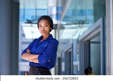 Portrait Of A Serious Young Business Woman Standing Outside Office Building