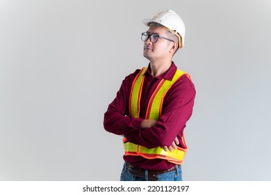 Portrait Of Serious Young Foreman With Hard Hat In A Studio. Architect, Engineer, Civil Concept Of Construction. 