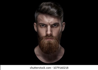 Portrait Of Serious Young Man Isolated On Black Background And Looking At Camera Confident Concep