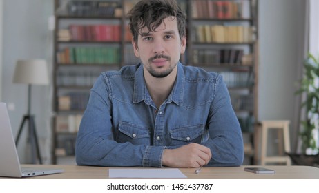 Portrait of Serious Young Man Looking at Camera in Casual Office - Shutterstock ID 1451437787
