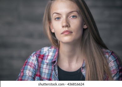 Portrait Of A Serious Young Woman