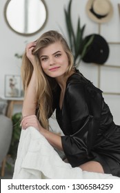 Portrait Of A Sexy Girl In Black Satin Pajamas