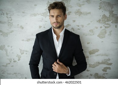Portrait Of Sexy Man In Black Suit