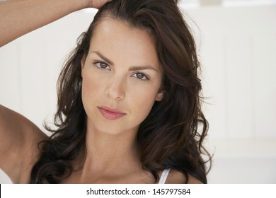 Portrait Of Sexy Young Woman With Hand In Hair