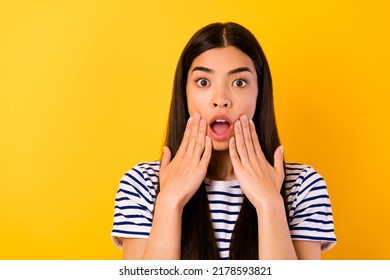 Portrait Of Shocked Malaysian Lady Hands Touch Cheeks Open Mouth Isolated On Yellow Color Background