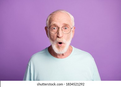 Portrait Of Shocked Old Man Wear Casual Cloth Eyeglasses Open Mouth Isolated On Purple Color Background