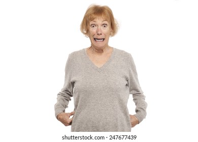 Portrait of an shocked senior woman against white background