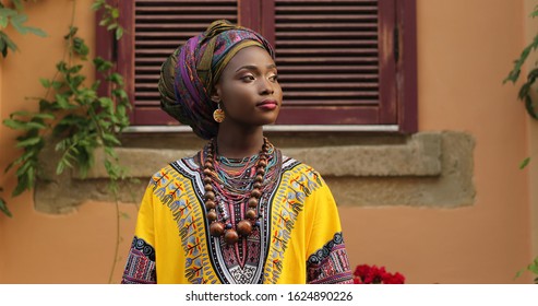 Portrait Shot Of Attractive And Stylish Young African Woman In Traditional Outfit Looking At The Side. 