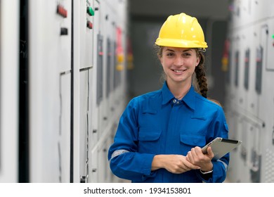 Portrait Shot Half Body Of Young Female Electrical Engineer In Electrical Control Room, Action Thump Up Showing The Good Services Working And Professional Concept.