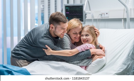 Portrait Shot of Happy Parents Hug Cute Little Girl Lying in the Hospital Bed! Amazing Emotional Moment, Family Bonding. - Powered by Shutterstock