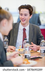 Portrait Shot Of A Middle School Student Eating Lunch In The School Cafeteria.