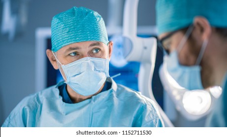 Portrait Shot of a Surgeon Thinking About Saving Life of a Patient. Diverse Team of Professional surgeons, Assistants and Nurses Performing Invasive Surgery on a Patient in the Hospital Operating Room