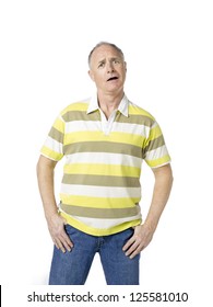 Portrait Shot Of A Surprised Old Man Against White Background.